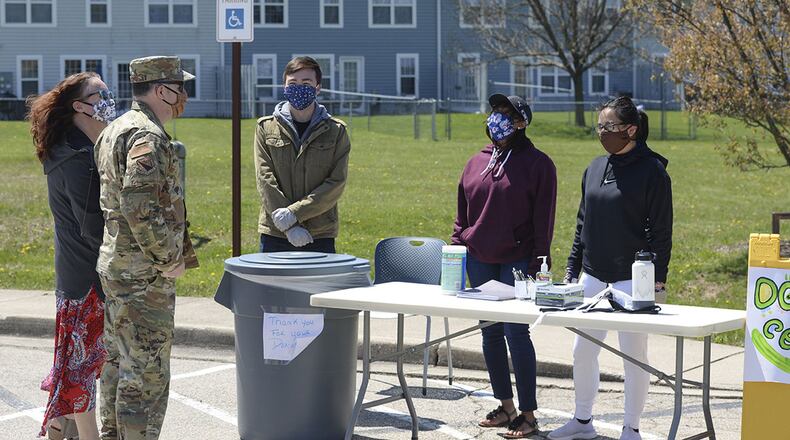 Col. Michael Phillips, 88th Air Base Wing vice commander, talks with volunteers staffing the wing’s donation drop-off point outside the chapel located in the Prairies housing area at Wright-Patterson Air Force Base, April 21. The center is open Monday to Friday between 1 and 5 p.m. (U.S. Air Force photo/Wesley Farnsworth)