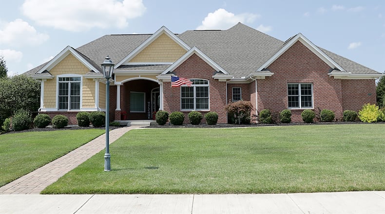 The brick-and-plank ranch has about 5,465 square feet of living space with a finished, walk-out lower level. The house is located at the end of a cul-de-sac and has a side-entry, 3-car garage. CONTRIBUTED PHOTO BY KATHY TYLER