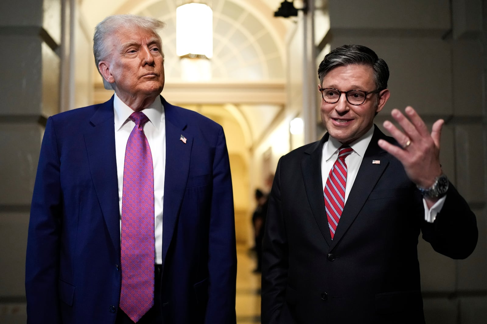 President Donald Trump and Speaker of the House Mike Johnson, R-La., speak to reporters after departing a House Republican conference meeting, Tuesday, May 20, 2025, at the U.S. Capitol in Washington. (AP Photo/Julia Demaree Nikhinson)