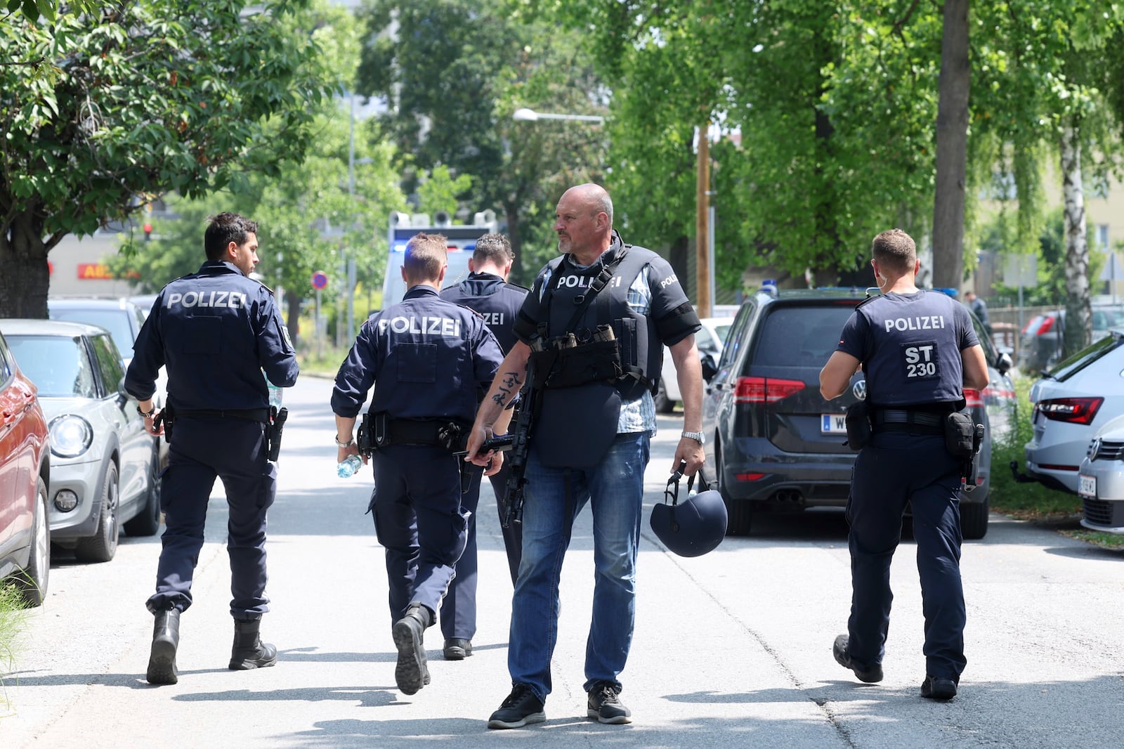 Police officers attend the scene of a shooting at a school in Graz, Austria, Tuesday, June 10, 2025. (Kleine Zeitung via AP)