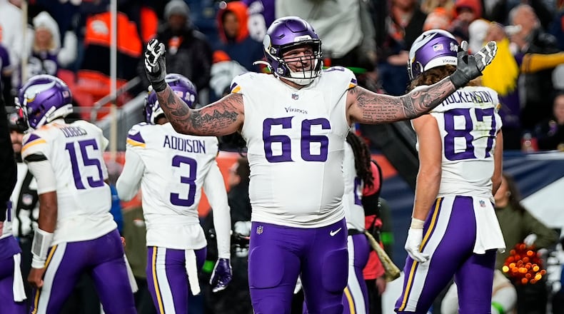 Minnesota Vikings guard Dalton Risner (66) celebrates a touchdown against the Denver Broncos during the second half on an NFL football game, Sunday, Nov. 19, 2023, in Denver. (AP Photo/Jack Dempsey)
