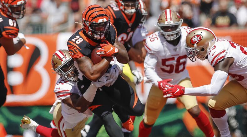 CINCINNATI, OH - SEPTEMBER 15: Joe Mixon #28 of the Cincinnati Bengals runs the ball as Dre Greenlaw #57 of the San Francisco 49ers makes the stop during the first half at Paul Brown Stadium on September 15, 2019 in Cincinnati, Ohio. (Photo by Michael Hickey/Getty Images) *** BESTPIX ***