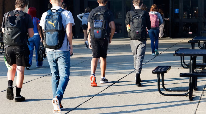Students arrive Wednesday, Aug. 14, 2024 for the first day of school at Beavercreek High School. MARSHALL GORBY\STAFF