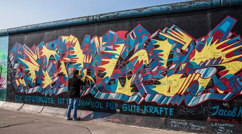 Murals covering the remains of the Berlin Wall, a dictator’s brutal tool, now symbolize peace and unification. (Steve Haggerty/ColorWorld/TNS)