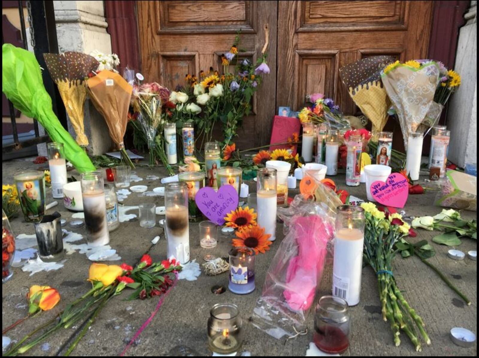 Makeshift memorial in front of Ned Peppers in the Oregon District.