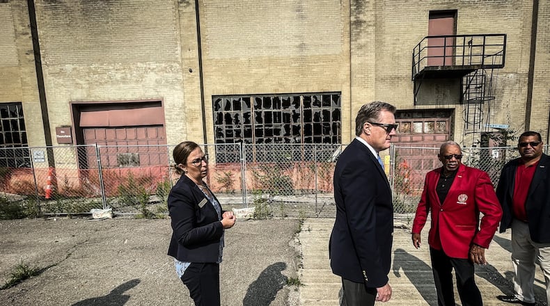 From left, Executive Director of the National Aviation Heritage Area Mackensie Wittmer, U.S. Rep. Mike Turner and Dayton Mayor Jeffery Mims Jr. tour the Wright Factory on West Third Street Tuesday August 1, 2023. JIM NOELKER/STAFF
