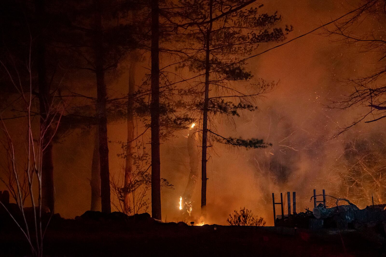 The Black Cove Fire burns on Wednesday, March 26, 2025, in Saluda, N.C. (AP Photo/Allison Joyce)