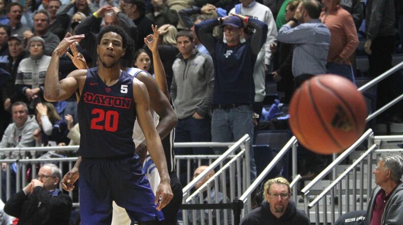 Dayton’s Xeyrius Williams reacts after making the go-ahead 3-pointer against Rhode Island with 10 seconds left on Friday, Feb. 10, 2017, at the Ryan Center in Kingston, R.I. David Jablonski/Staff