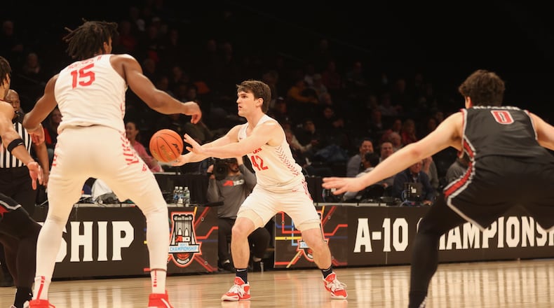 Dayton's Brady Uhl makes a pass against Saint Joseph’s in the quarterfinals of the Atlantic 10 Conference tournament on Thursday, March 9, 2023, at the Barclays Center in Brooklyn, N.Y. David Jablonski/Staff