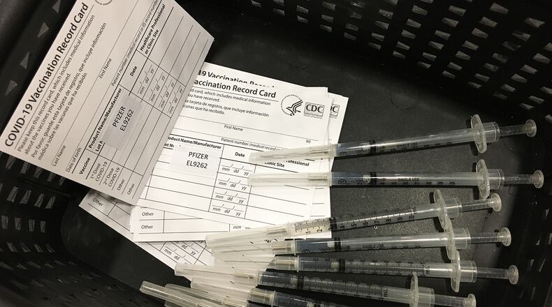 Hundreds of people arrived at the Dayton Convention Center Wednesday morning, Jan. 20, 2021, for the COVID-19 vaccination.