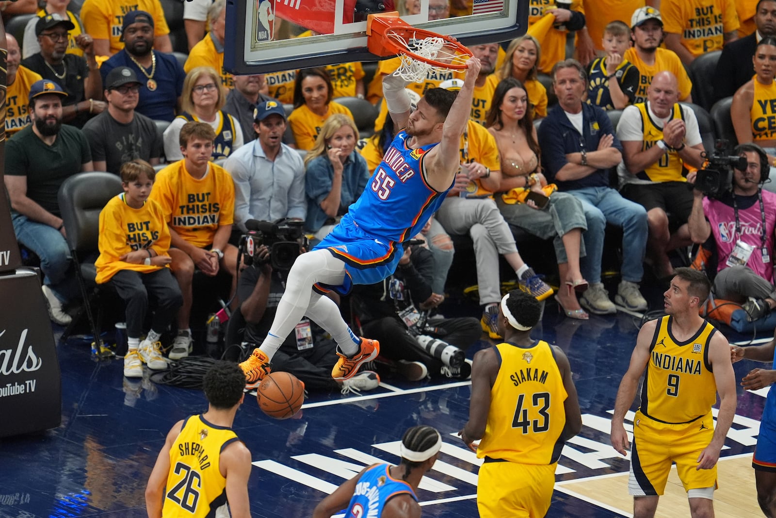 Oklahoma City Thunder center Isaiah Hartenstein (55) dunks against the Indiana Pacers during the first half of Game 3 of the NBA Finals basketball series, Wednesday, June 11, 2025, in Indianapolis. (AP Photo/Michael Conroy)