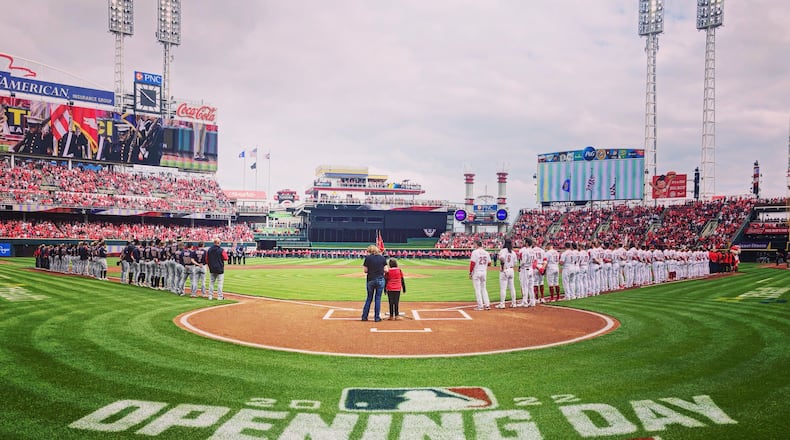 The Reds and Guardians stand for the national anthem on Opening Day on Tuesday, April 12, 2022, at Great American Ball Park in Cincinnati. David Jablonski/Staff