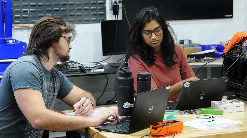 Aeroseal employees, Bobby Phillips, left, and Kruthi Anumandla, run tests on new products. MARSHALL GORBY\STAFF