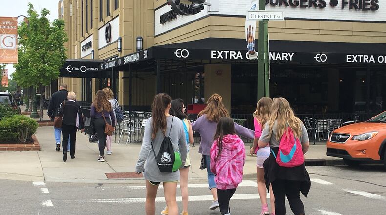 Shoppers walk through The Greene Town Center in Beavercreek. KARA DRISCOLL/STAFF