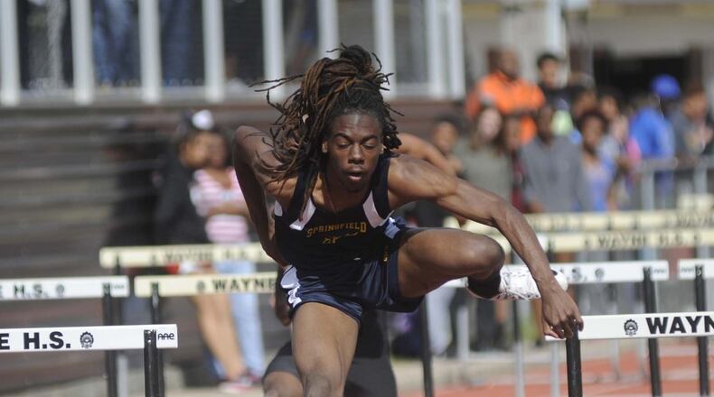 Springfield High School junior Dyier Smith, shown during Thursday’s qualifying, won the 110-meter high hurdles in a personal-best 14.42 on Friday during the rain-canceled Wayne track and field invitational at Huber Heights. MARC PENDLETON / STAFF
