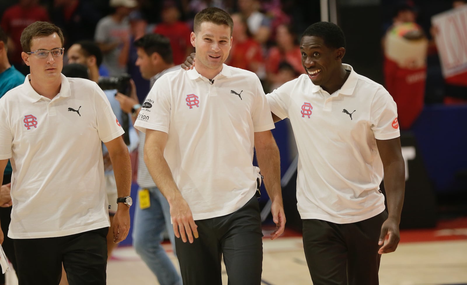 The Red Scare's coaches, Joey Gruden and Jeremiah Bonsu, smile after a victory against the Golden Eagles in The Basketball Tournament on Wednesday, July 27, 2022, at UD Arena. David Jablonski/Staff