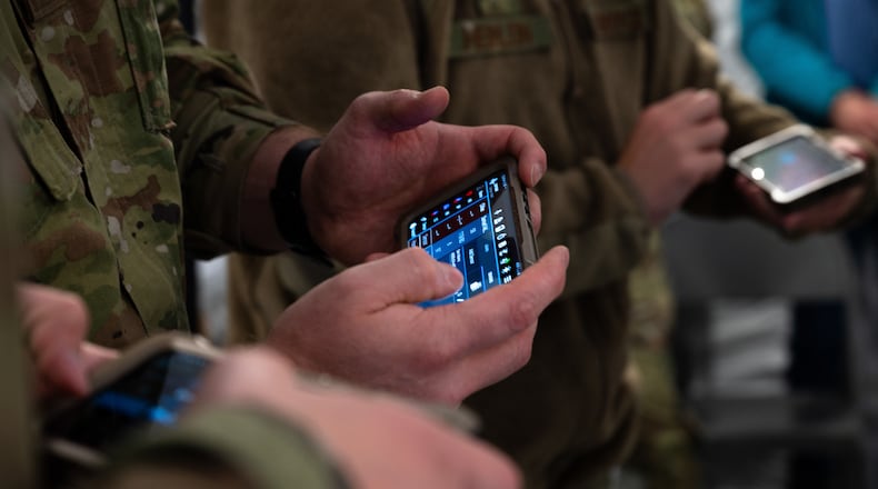 U.S. Airmen assigned to the 354th and 673rd Medical Group use a Battlefield Assisted Trauma Distributed Observation Kit (BATDOK) during a Capabilities-Based Assessment at the Yukon Training Area, Sept. 14, 2021. The BATDOK is a real-time, multi-patient health status monitoring and documentation tool used to integrate patient data into their health records and helps identify exact locations of casualties. (U.S. Air Force photo by Airman 1st Class Jose Miguel T. Tamondong)