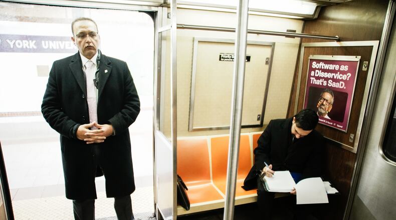 New York City Mayor Zohran Mamdani checks his agenda on the subway on his way to City Hall in New York, Friday, Jan. 2, 2026. (AP Photo/Eduardo Munoz Alvarez)