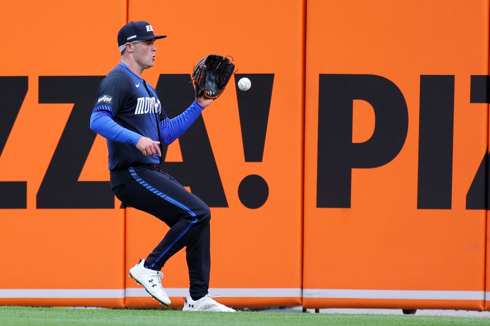 Detroit Tigers right fielder Kerry Carpenter chases down a double hit by Cleveland Guardians' Steven Kwan during the first inning of a baseball game Friday, May 23, 2025, in Detroit. (AP Photo/Duane Burleson)