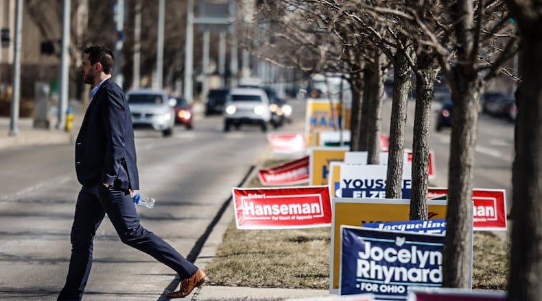 Political signs line the middle of Third Street in front of the Montgomery County Board of Elections on Wednesday Feb. 21, 2024, the first day of early voting in the March 19 election. JIM NOELKER/STAFF