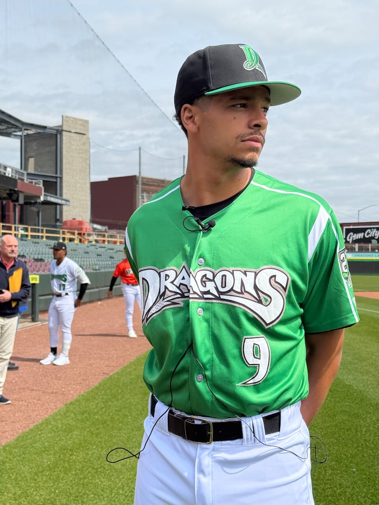 Dragons pitcher Chase Burns waits for an interview