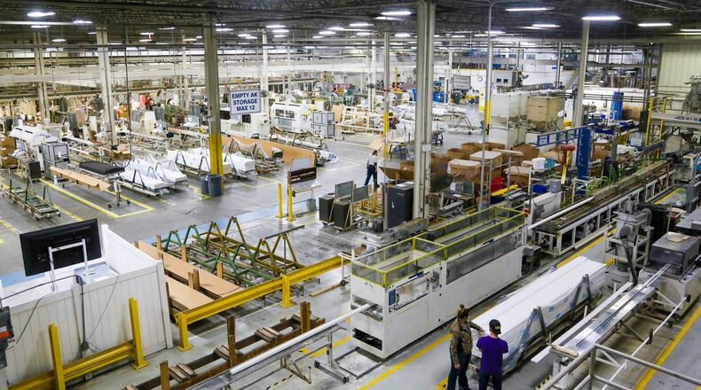 Extrusion operators produce vinyl window parts at Deceuninck North America in Monroe, Wednesday, Apr. 12, 2017. GREG LYNCH / STAFF