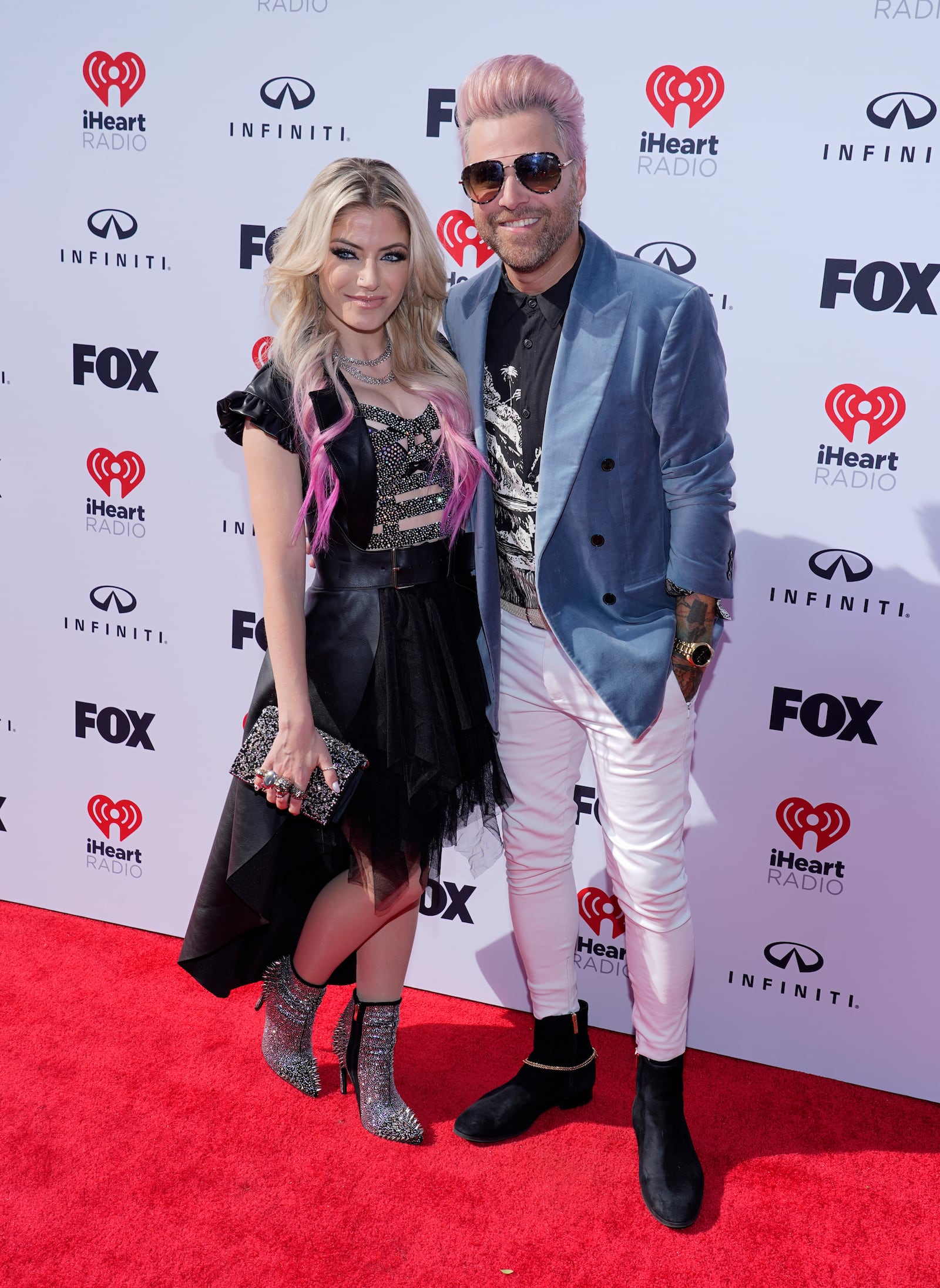 Alexa Bliss, left, and Ryan Cabrera arrive at the iHeartRadio Music Awards on Monday, March 27, 2023, at the Dolby Theatre in Los Angeles. (AP Photo/Chris Pizzello)