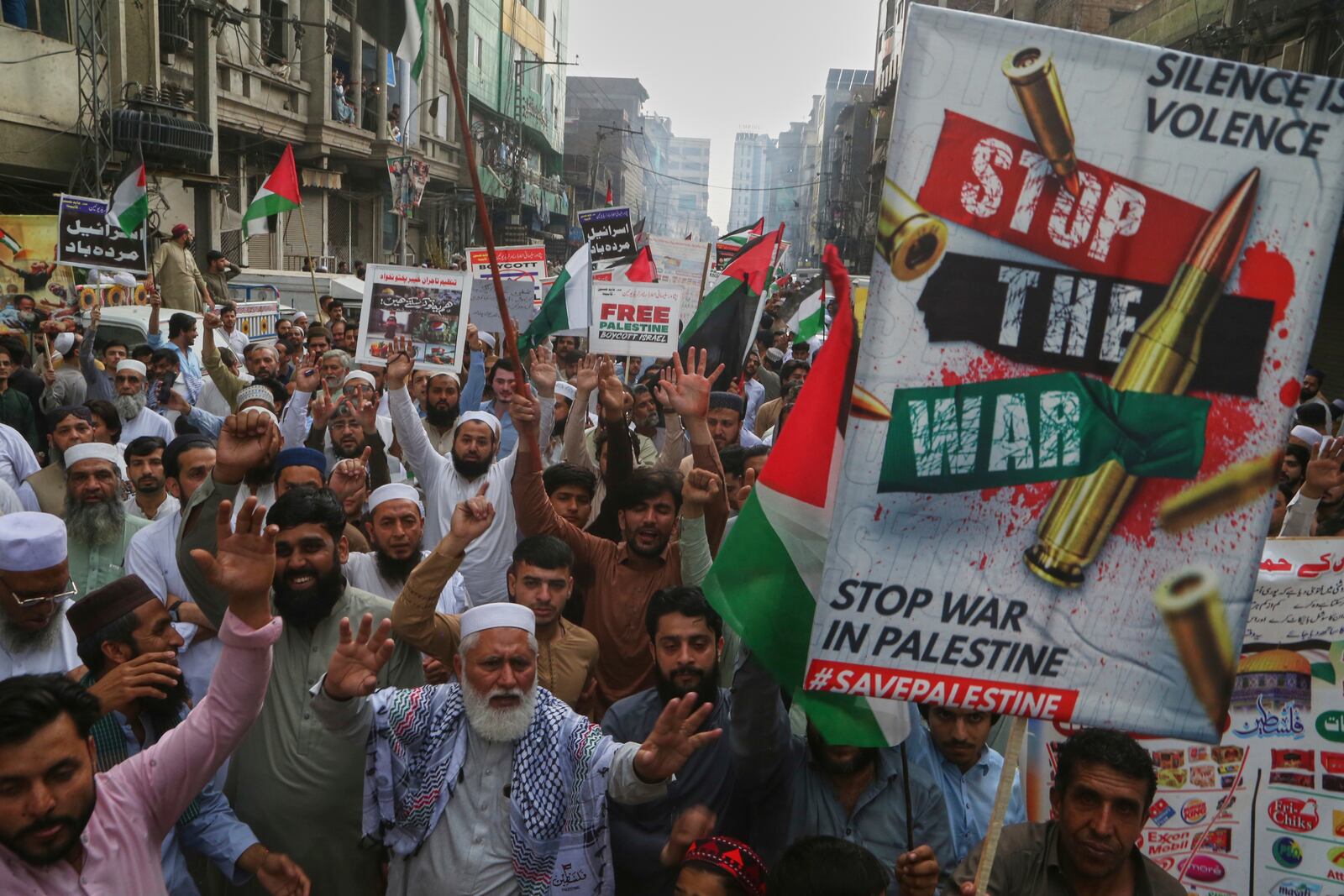 Traders hold a demonstration against Israeli airstrikes and to show solidarity with Palestinian people living in Gaza, in Peshawar, Pakistan Friday, April 18, 2025. (AP Photo/Muhammad Sajjad)