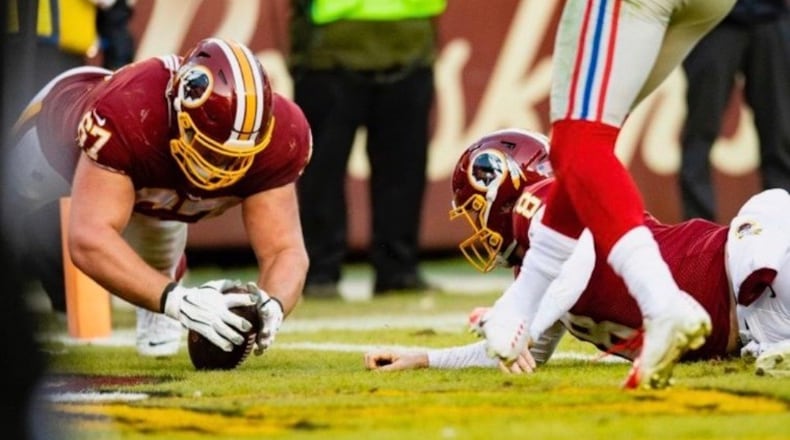 Milton Union High’s All-Ohio offensive lineman Wes Martin smothers a defender with a pancake block in a high school game. CONTRIBUTED PHOTO