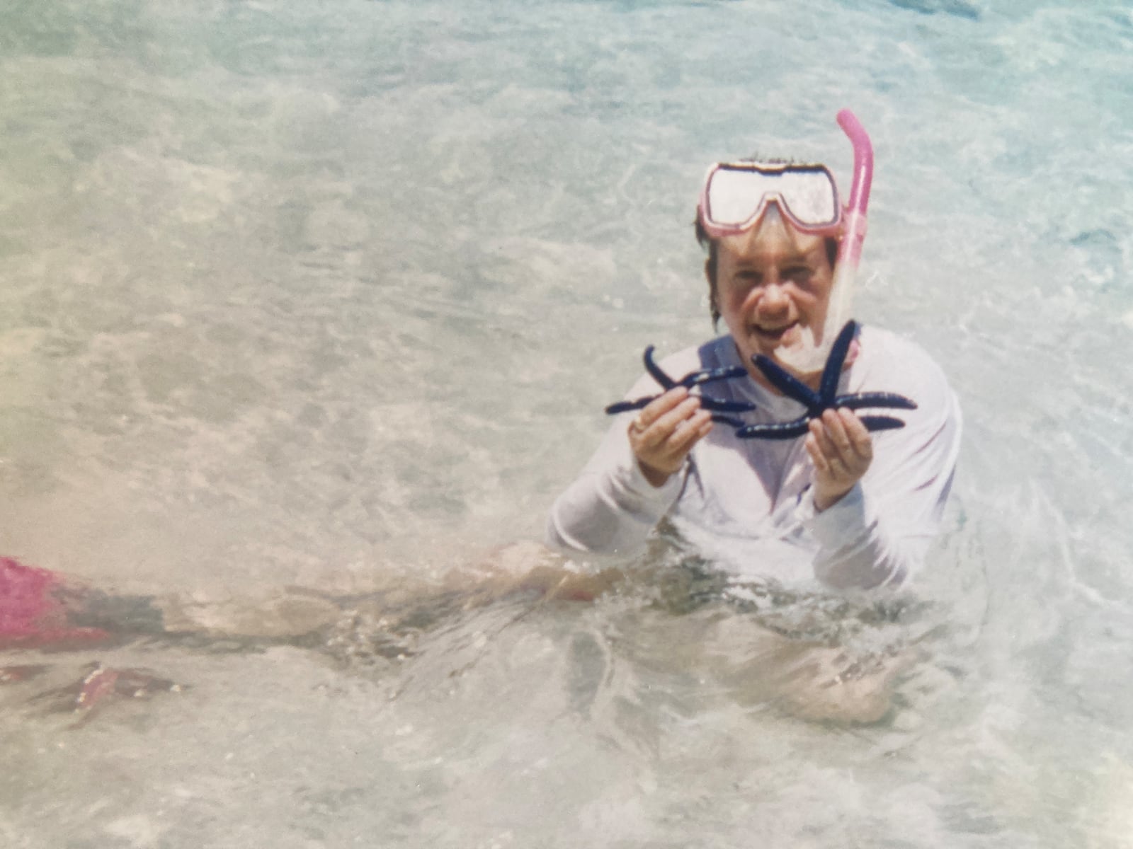 Pat Bell visited Fiji in the South Pacific in late 1999. She loved snorkeling and scuba diving while there and is shown holding blue starfish - the only place in the world she has ever seen them. CONTRIBUTED