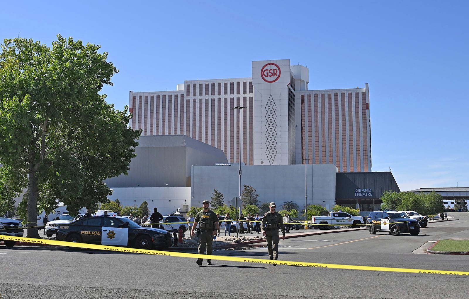 Police respond to a shooting outside the Grand Sierra Resort in Reno, Nev., Monday, July 28, 2025. (AP Photo/Andy Barron)