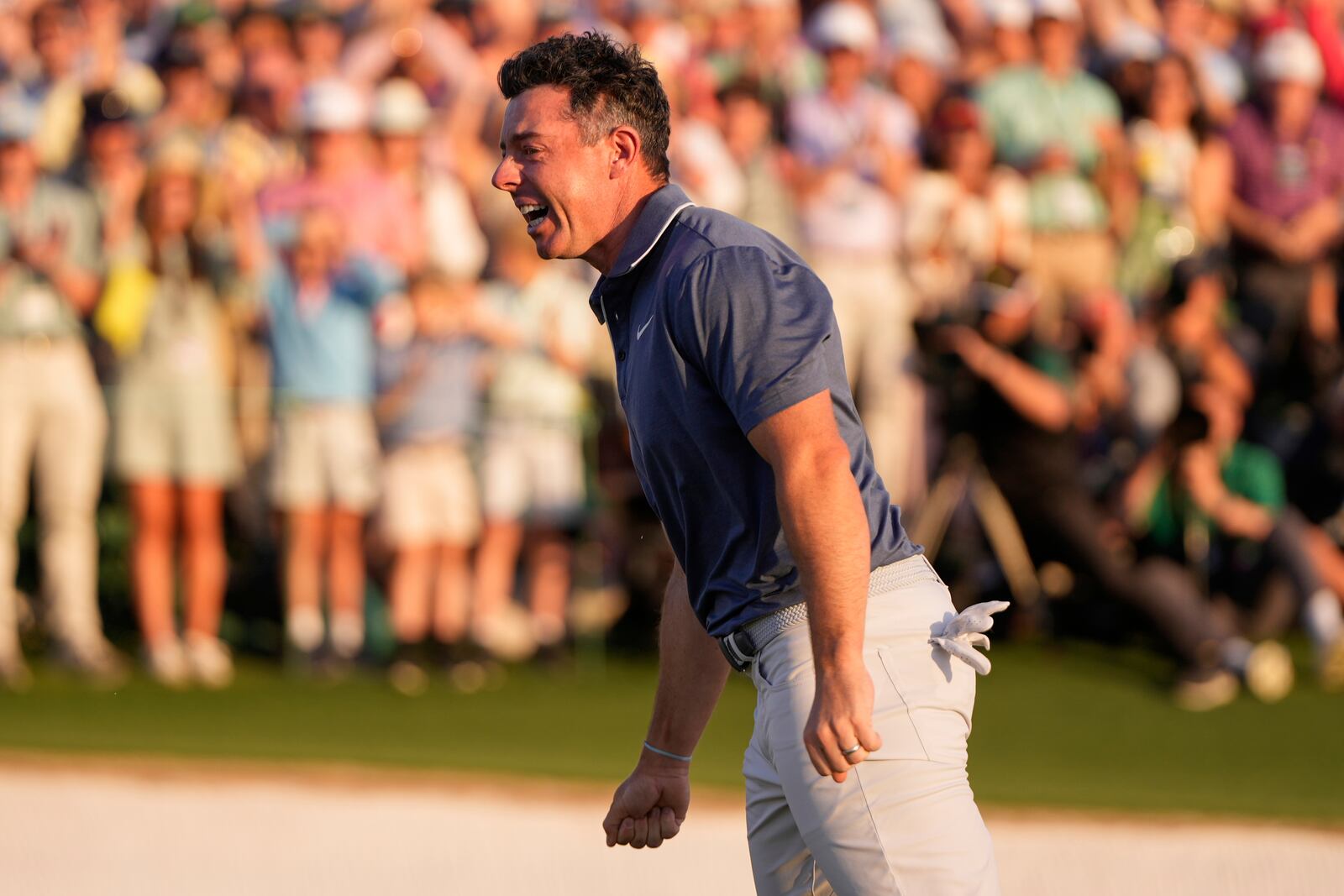 Rory McIlroy, of Northern Ireland, celebrates winning in a playoff against Justin Rose, of England, after the final round the Masters golf tournament, Sunday, April 13, 2025, in Augusta, Ga. (AP Photo/Julia Demaree Nikhinson)