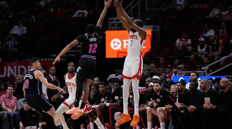 Houston Rockets forward Kevin Durant (7) shoots against Miami Heat guard Dru Smith (12) during the first half of an NBA basketball game in Houston, Saturday, March 21, 2026. (AP Photo/Ashley Landis)