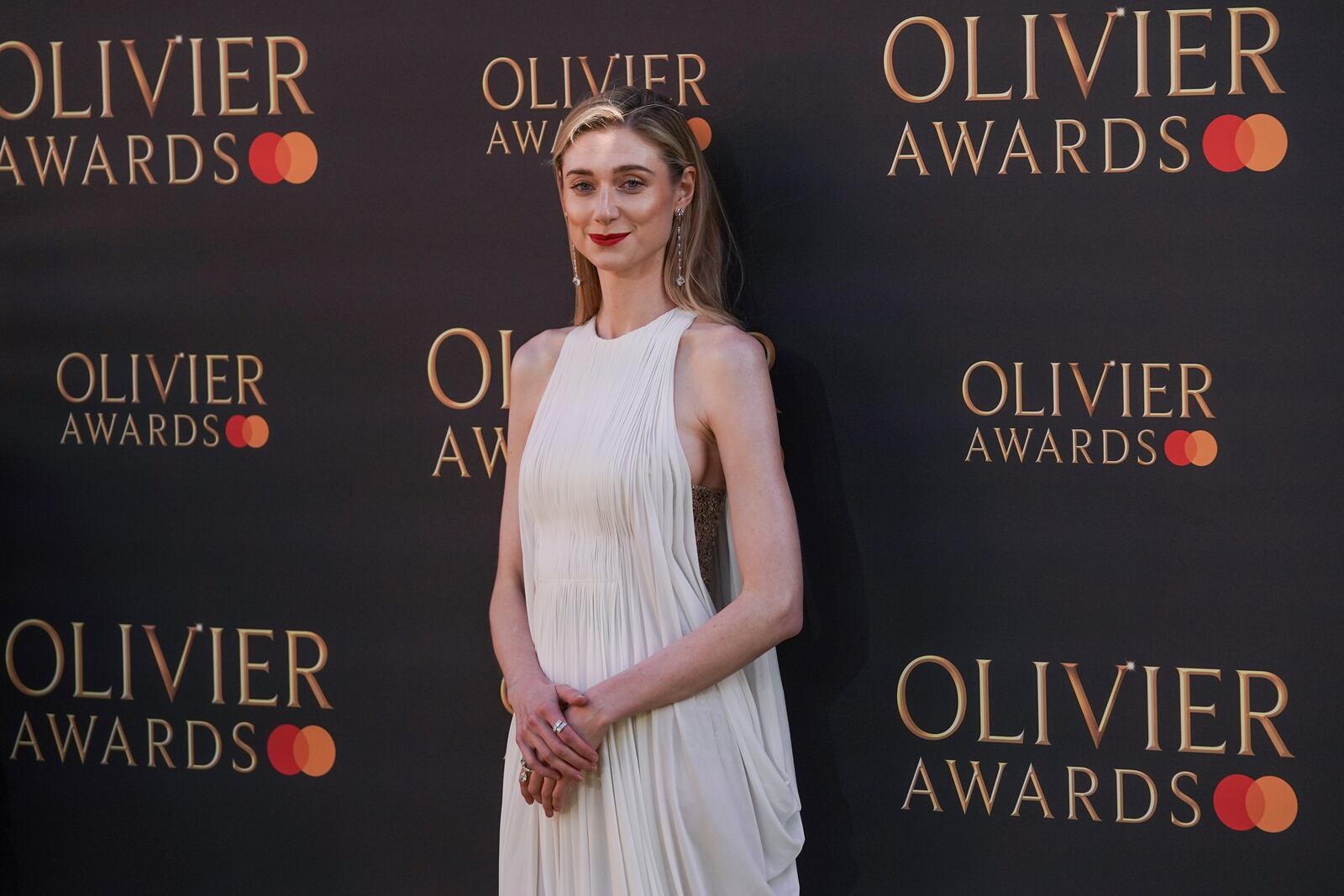 Elizabeth Debick poses for photographers upon arrival at the Olivier Awards on Sunday, April 6, 2025, in London. (Photo by Alberto Pezzali/Invision/AP)