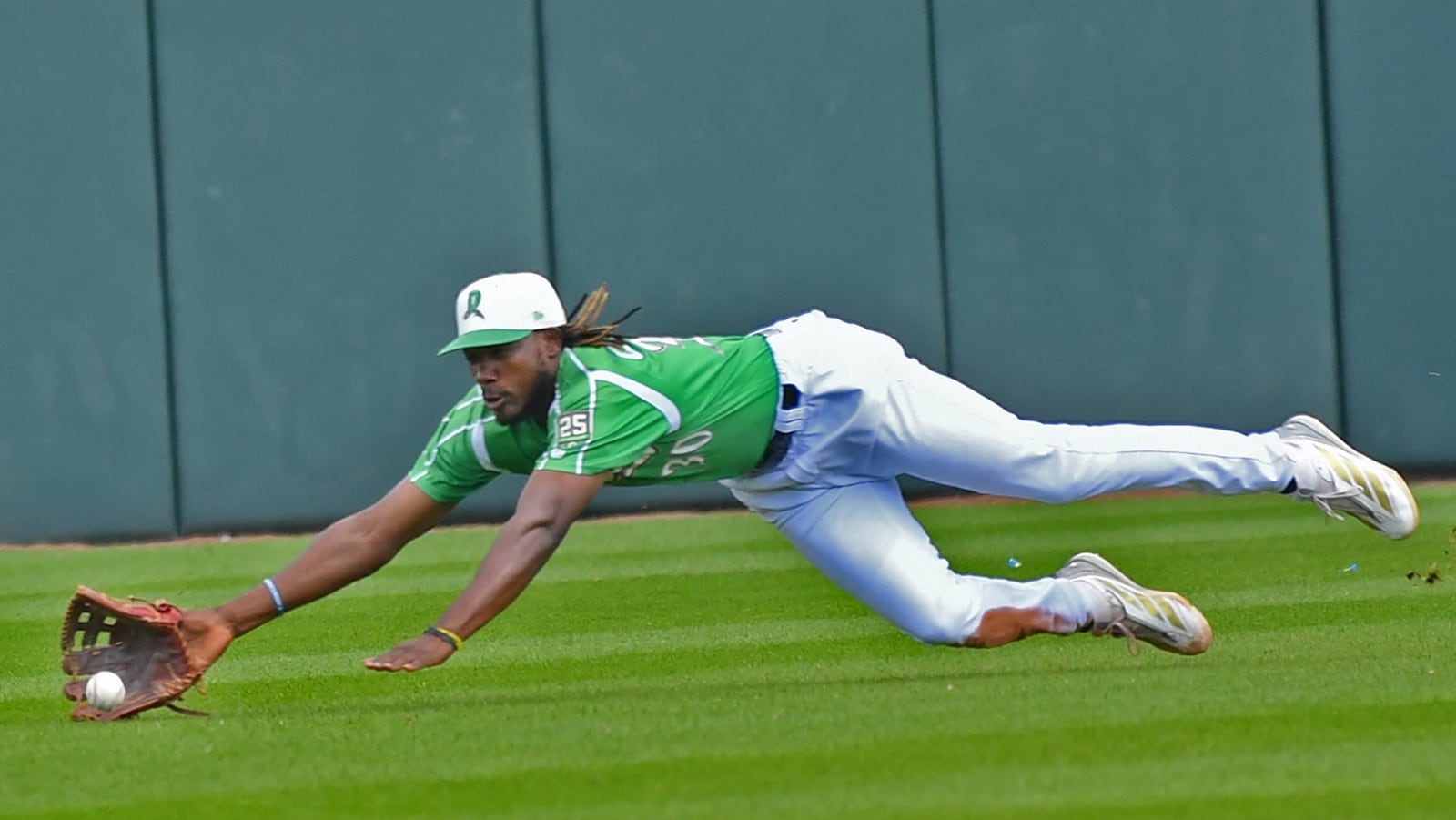 Dayton center fielder Yerlin Confidan dives for a line drive that got past him for a double in the third inning Sunday at Day Air Ballpark. The runner was left on base. JEFF GILBERT/CONTRIBUTED