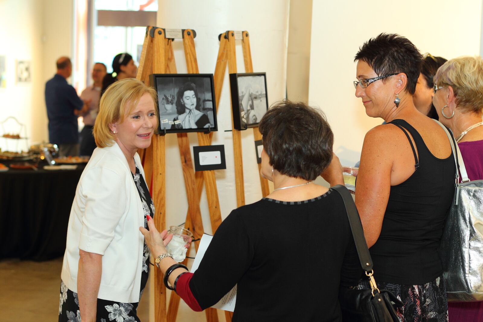 Eve Plumb discusses her artwork during a private event June 12th at DVAC. Plumb's work "Film Noir & Classic Western Scenes" will be on display at DVAC through June 17, 2017. CONTRIBUTED PHOTO BY SCOTT KIMMINS