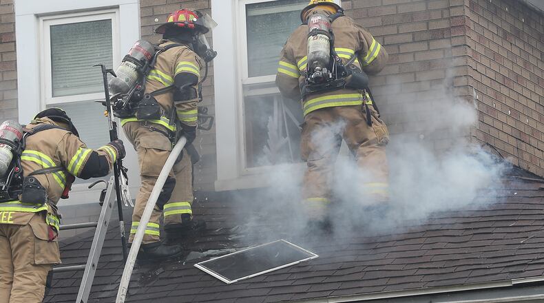 The Springfield Fire Division battles a two story house fire on West Euclid Avenue last year. The city is currently planning to invest millions of dollars in American Rescue Plan dollars in order to build three new fire stations. BILL LACKEY/STAFF