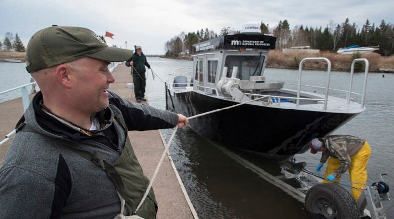 Cory Goldsworthy helps put the new Department of Natural Resources' 31-foot boat on a trailer during an annual spring population survey on Lake Superior on Tuesday, May 8, 2018 in Duluth, Minn. (Jerry Holt/Minneapolis Star Tribune/TNS)