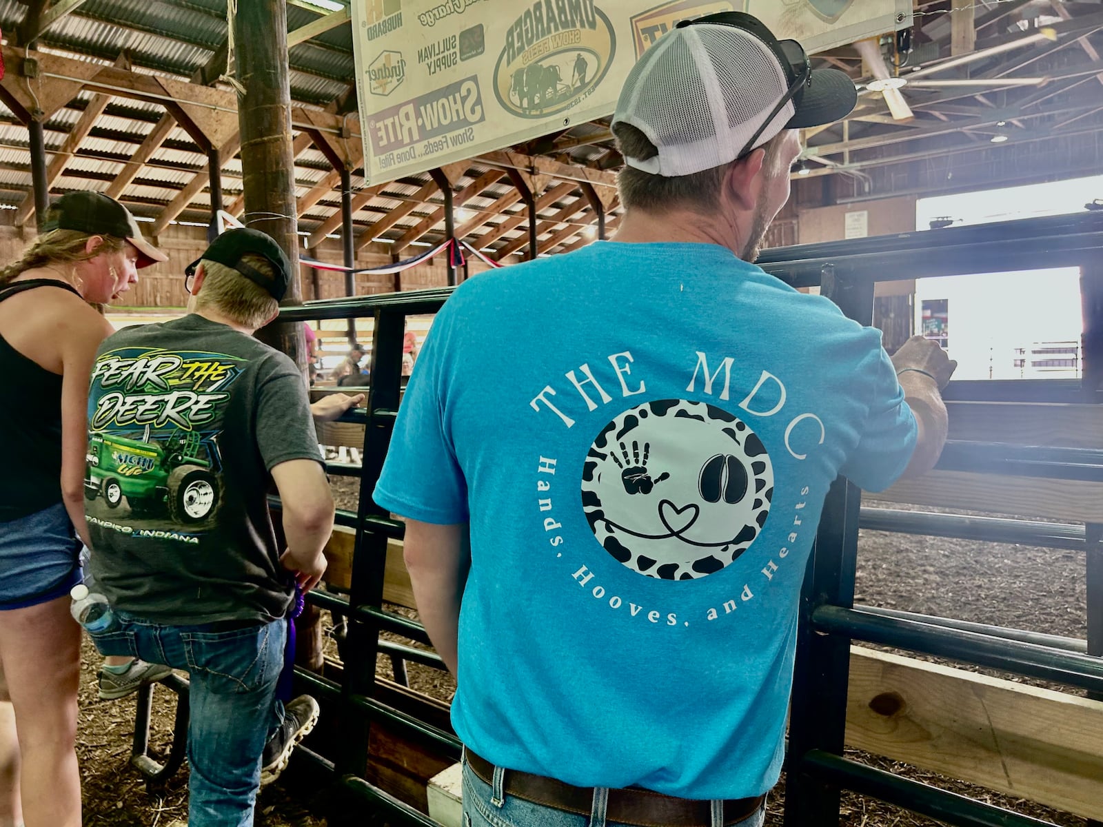 Tony Niccum, Emily Mullen's husband, wears Hands, Hooves and Hearts shirt at Butler County Fair. TAYLOR STUMBAUGH/STAFF