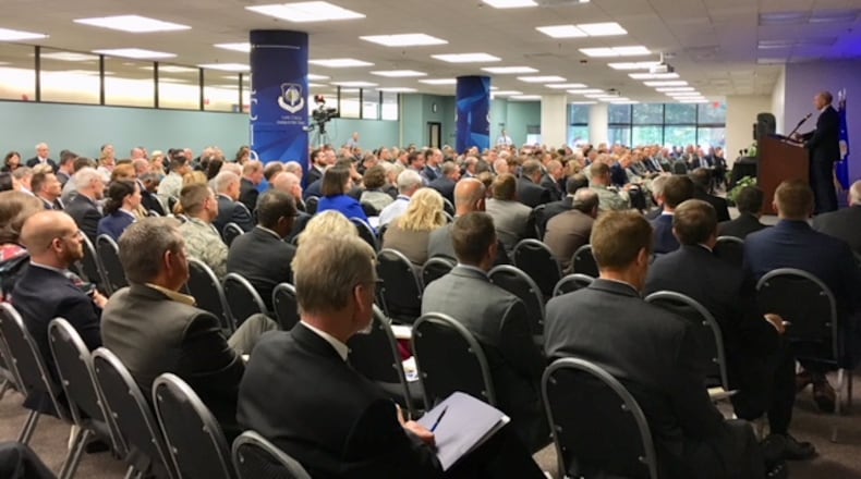 A packed house listens to U.S. Air Force Gen. James Holmes, commender of the Air Combat Command, at Life Cycle Industry Days, a three-day conference that opened Wednesday at Daniel J. Curran Place at the University of Dayton. THOMAS GNAU/STAFF