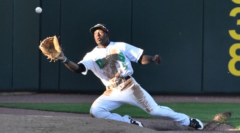 Taylor Trammell catches a foul ball near the Dayton bullpen on the left field line during the third inning of a game against South Bend on Saturday night at Fifth Third Field. Contributed Photo by Bryant Billing