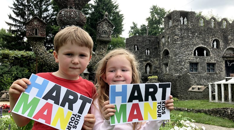 Jacek and Zosia Rose display the brochure visitors to Springfield's Hartman Rock Garden can use when they take the new self-guided kids tour for ages 7-12. CONTRIBUTED