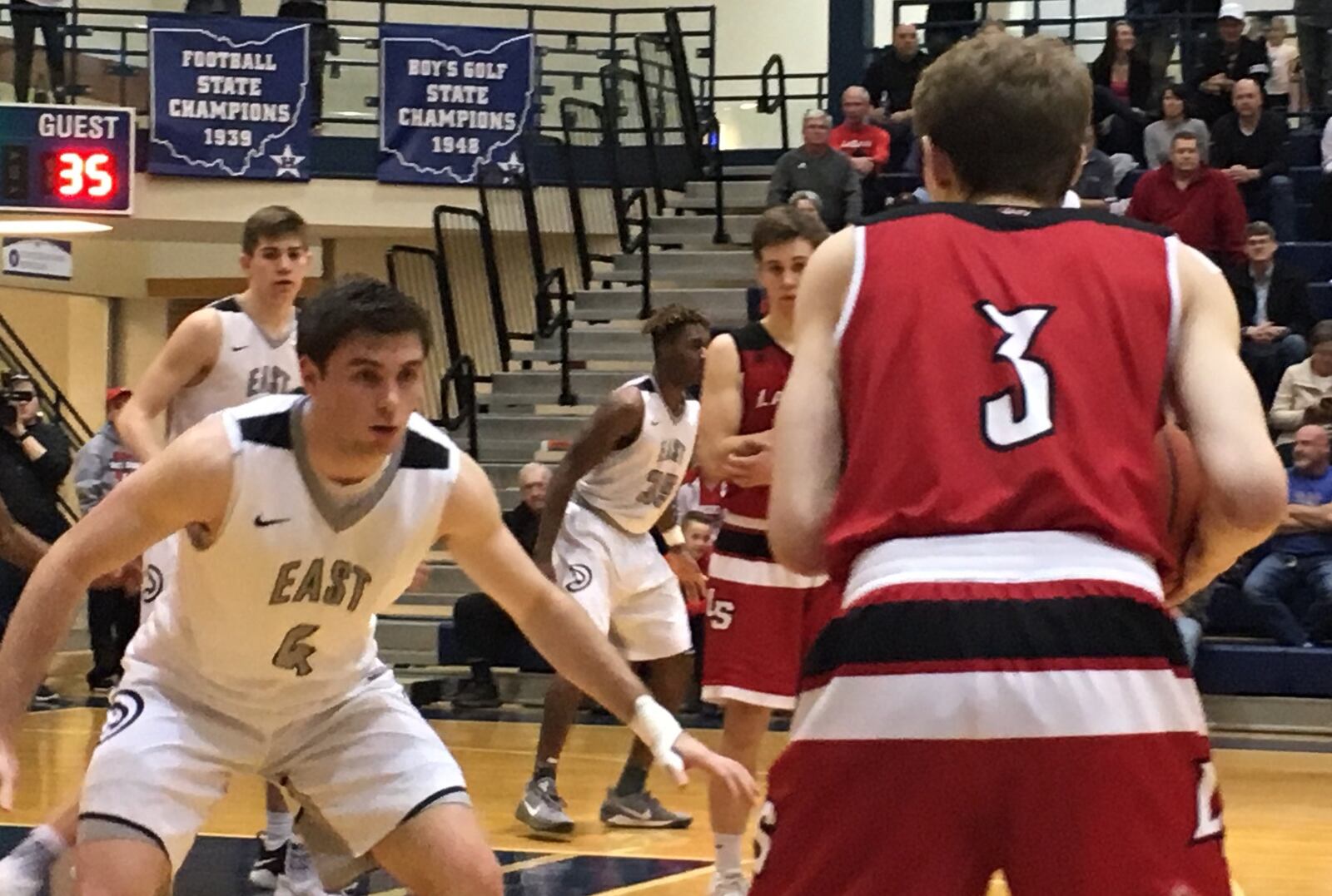 Lakota East’s Jackson See (4) keeps a close eye on La Salle’s Riley Haubner (3) during Friday night’s Division I sectional final at the Hamilton Athletic Center. RICK CASSANO/STAFF