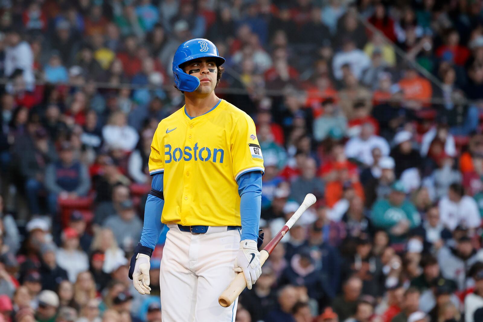 Boston Red Sox third baseman Marcelo Mayer reacts after being called out on strikes in his first major league at bat during the second inning of the second baseball game of a doubleheader against the Baltimore Orioles, Saturday, May 24, 2025, at Fenway Park in Boston. (AP Photo/Mary Schwalm)