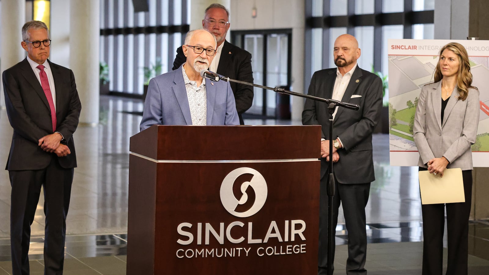 Joe Sciabica, the executive director of the Dayton Foundation's Employers Workforce Coalition and Sinclair Community College trustee, speaks during a news conference on campus on Thursday, Nov. 20. The university announced it is spending $30 million to remodel Building 8, its former field house, and create a future technology center. BRYANT BILLING/STAFF