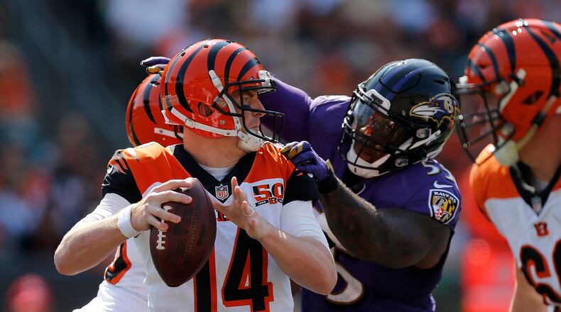 CINCINNATI, OH - SEPTEMBER 10: Terrell Suggs #55 of the Baltimore Ravens sacks Andy Dalton #14 of the Cincinnati Bengals during the fourth quarter at Paul Brown Stadium on September 10, 2017 in Cincinnati, Ohio. (Photo by Michael Reaves/Getty Images)