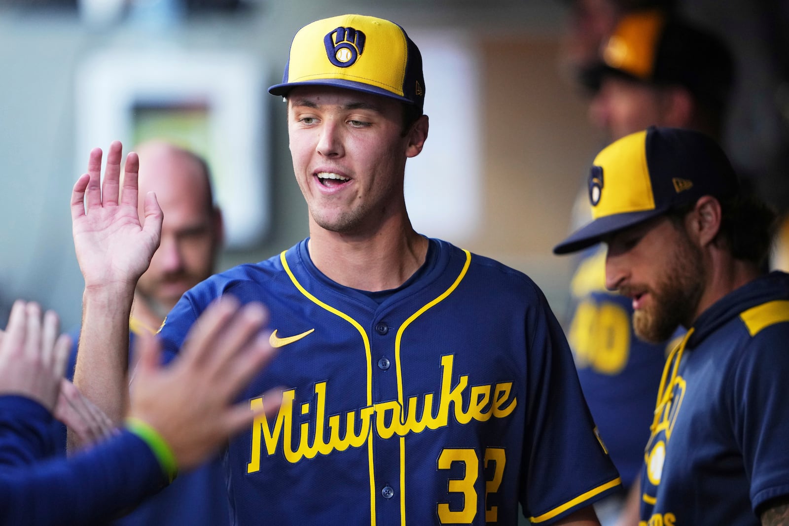 Milwaukee Brewers starting pitcher Jacob Misiorowski is greeted in the dugout after being taken out of a baseball game against the Seattle Mariners during the fourth inning Tuesday, July 22, 2025, in Seattle. (AP Photo/Lindsey Wasson)