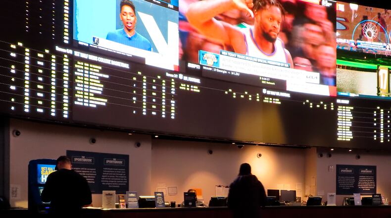 People make bets at the sportsbook at the Ocean Casino Resort, Feb. 10, 2022, in Atlantic City, N.J. The days of sports leagues lobbying against widespread legalized sports betting, preventing broadcast partners from discussing point spreads and even prohibiting players from holding a fantasy football convention because it was at a casino are firmly in the past. (AP Photo/Wayne Parry, File)