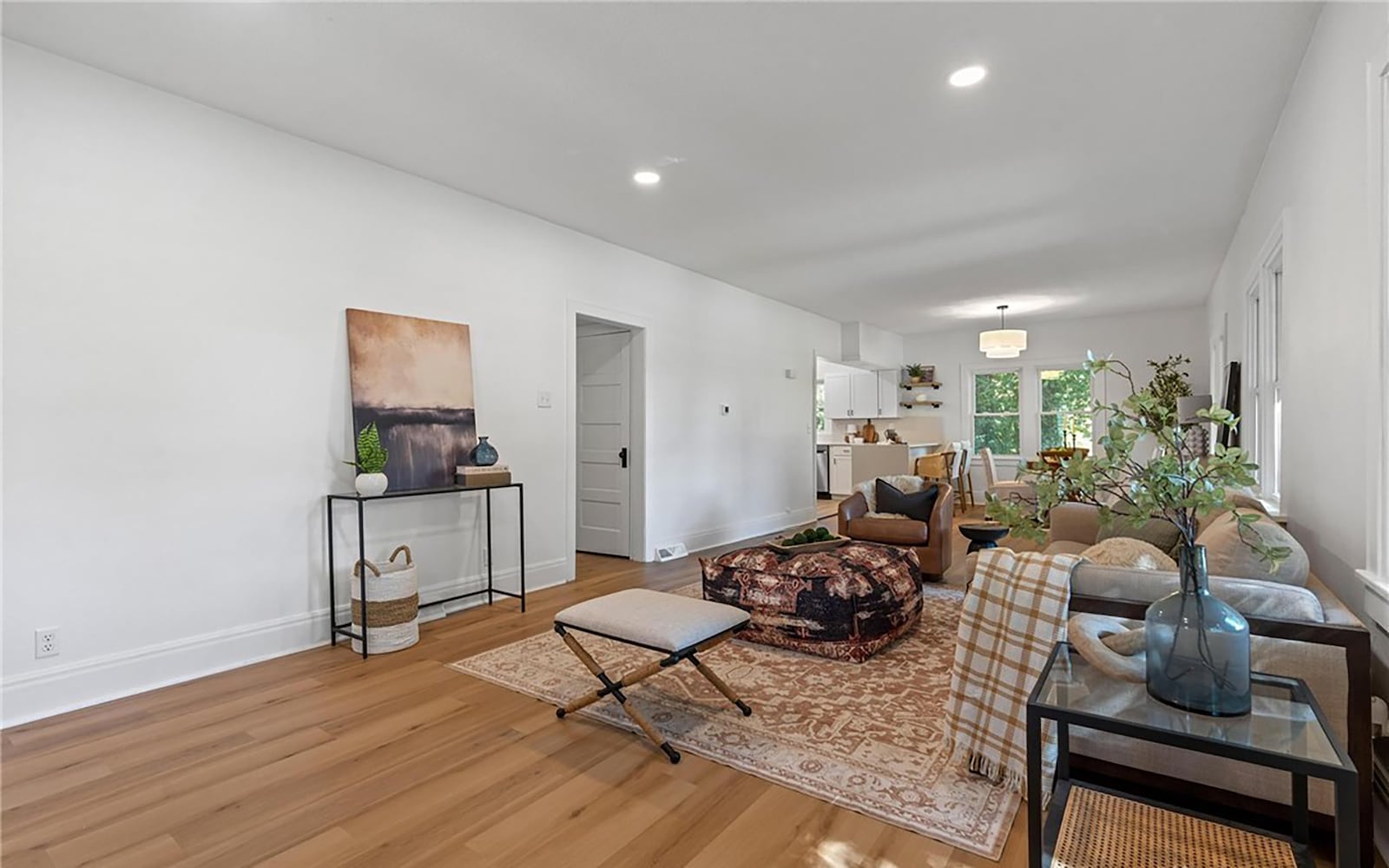 The living room runs along the side of the home and is open to the dining area. The entire room has LVP flooring and all new lighting fixtures. CONTRIBUTED