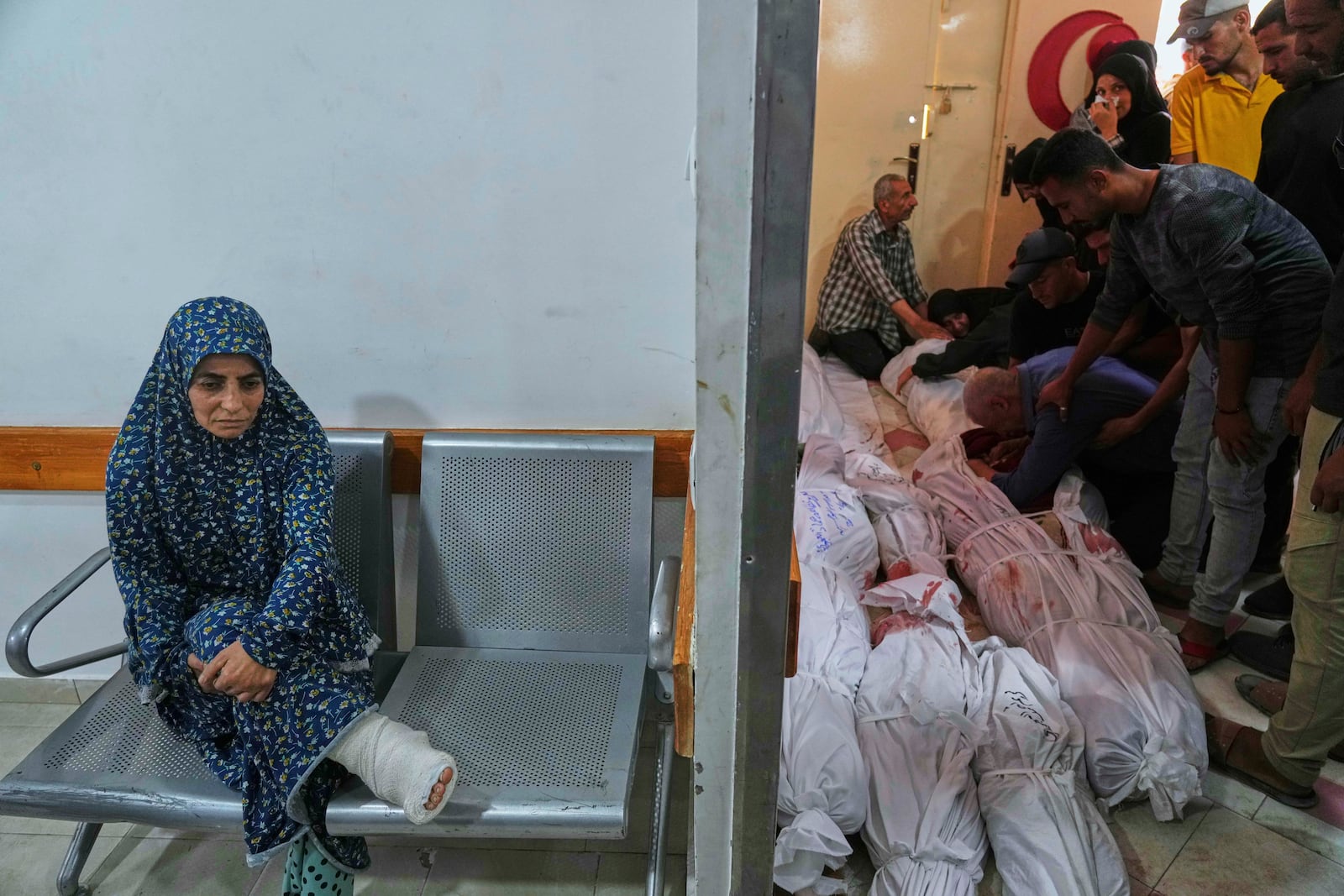 Palestinians mourn their relatives killed in an Israeli airstrikes in Jabalia, northern Gaza Strip, on Wednesday, May 14, 2025. According to local hospitals, 48 people were killed in the strikes, including 22 children. (AP Photo/Jehad Alshrafi)